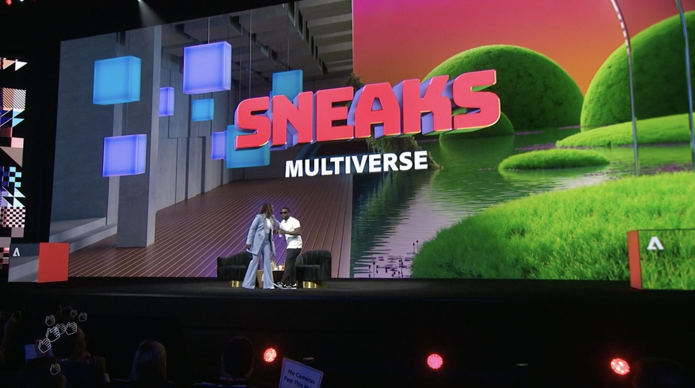 Kevin Hart and Bria Alexander on stage with 'Sneaks Multiverse' text projected in the background