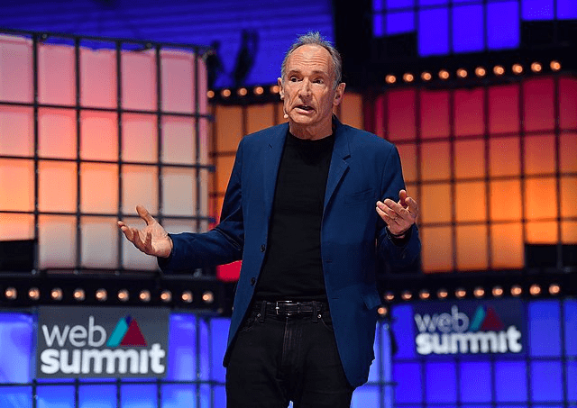 Tim Berners Lee, the inventer of the internet stood on stage at Web Summit conference with hands held out open